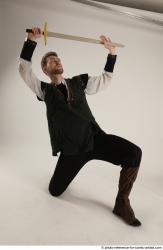 KEETA KNEELING POSE WITH SWORD